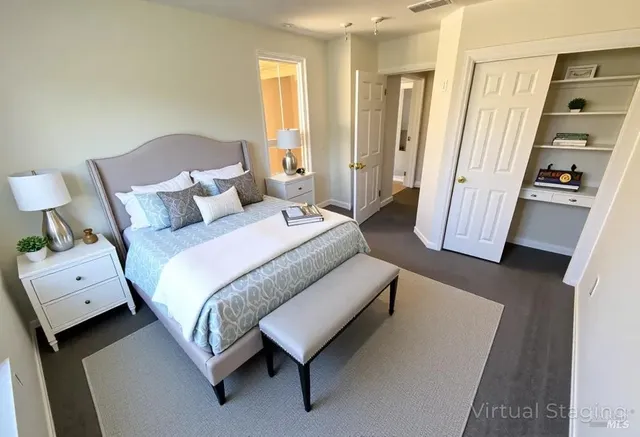 a spacious bedroom with a bed and a couch