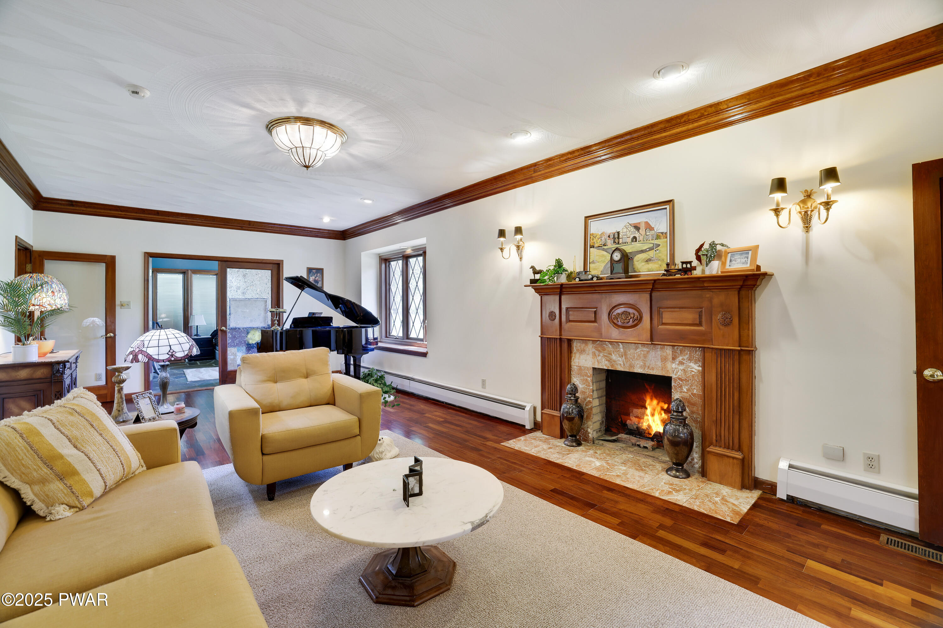 555 Valley View Road Dallas, PA 18612 - Photo 24 of 99 a living room with furniture and a fireplace