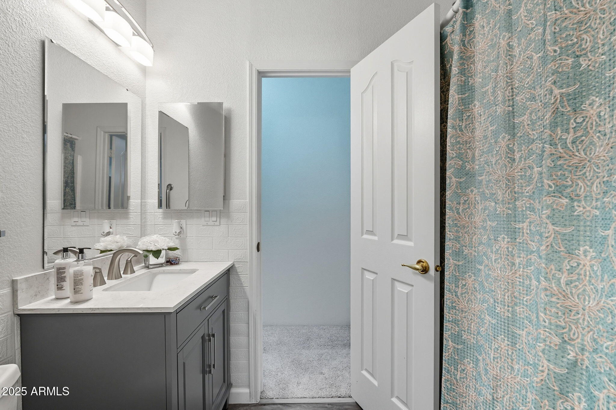 3700 South Tomahawk Road, Unit 39 Apache Junction, AZ 85119 - Photo 6 of 53 a bathroom with a sink and a mirror