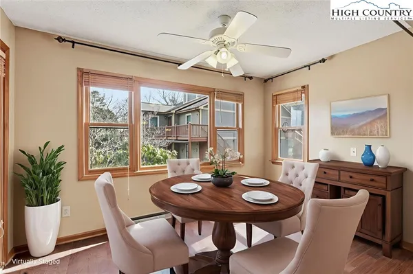 a view of a dining room with furniture window and outside view