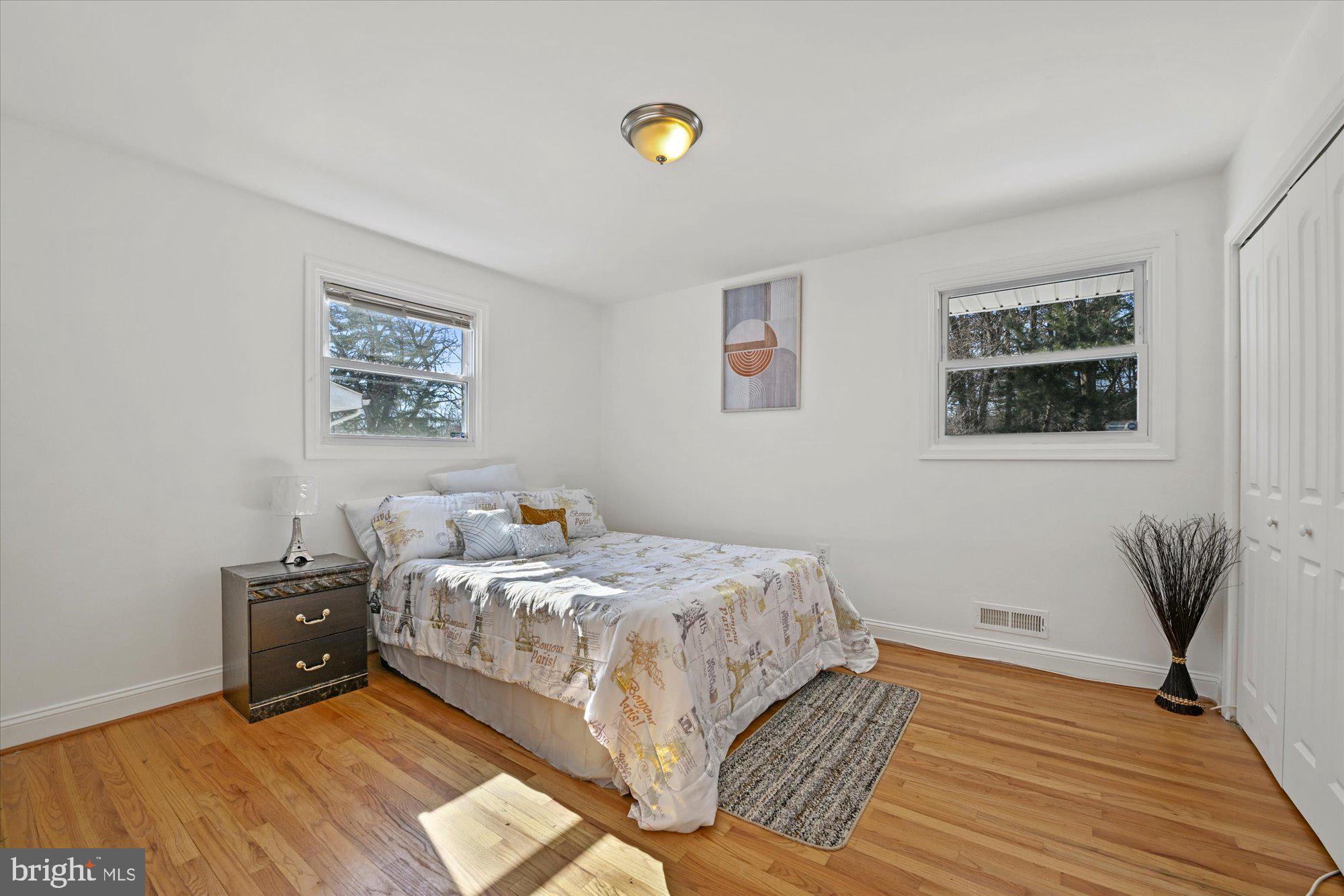 125 Allgate Road Owings Mills, MD 21117 - Photo 13 of 28 Primary Bedroom with hardwood flooring