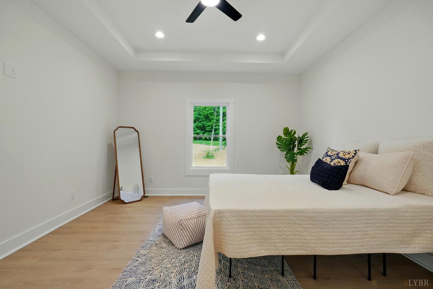 162 Dillon Cabin Road Moneta, VA 24121 - Photo 19 of 31 a bedroom with a bed and chandelier