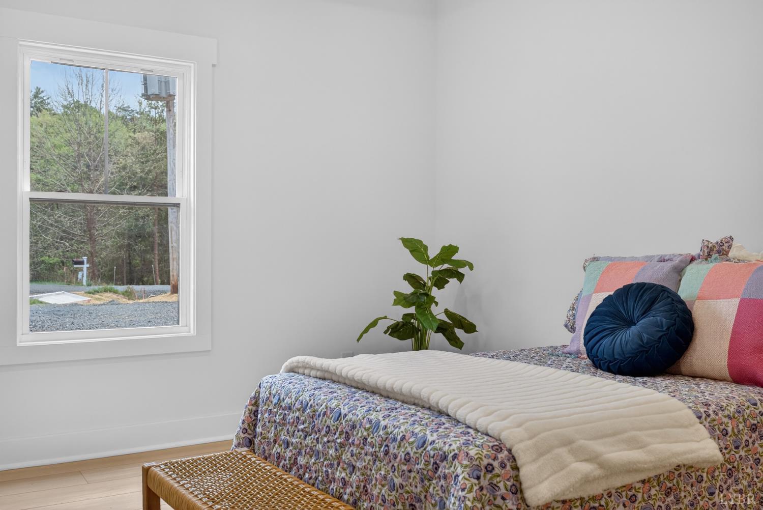 162 Dillon Cabin Road Moneta, VA 24121 - Photo 30 of 56 a bedroom with a bed and wooden floor
