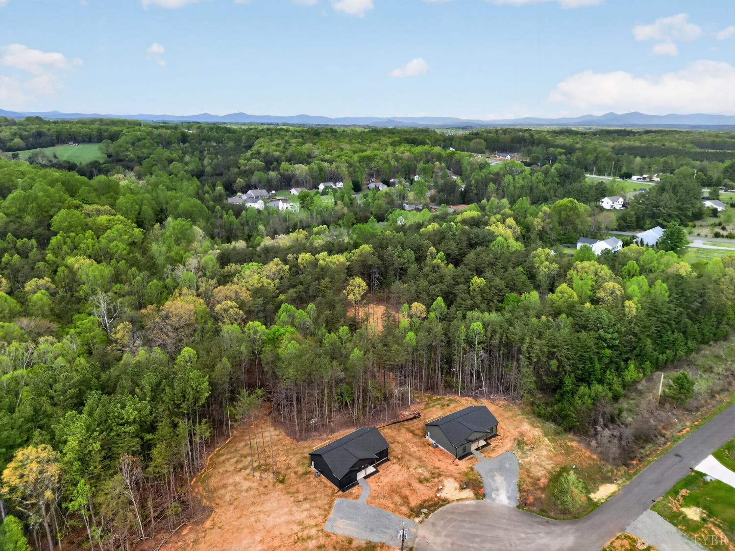 162 Dillon Cabin Road Moneta, VA 24121 - Photo 54 of 56 a view of a city with lush green forest