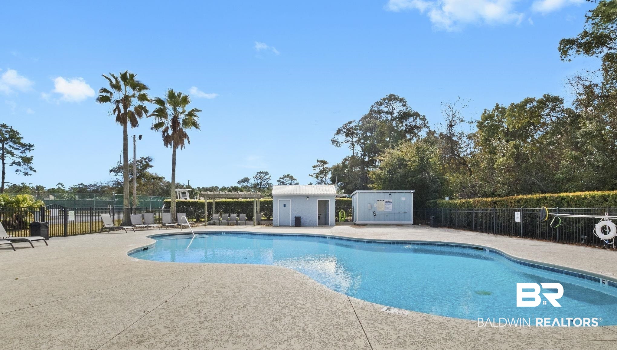 25861 Canal Road, Unit 77 Orange Beach, AL 36561 - Photo 43 of 48 Community pool with a patio area