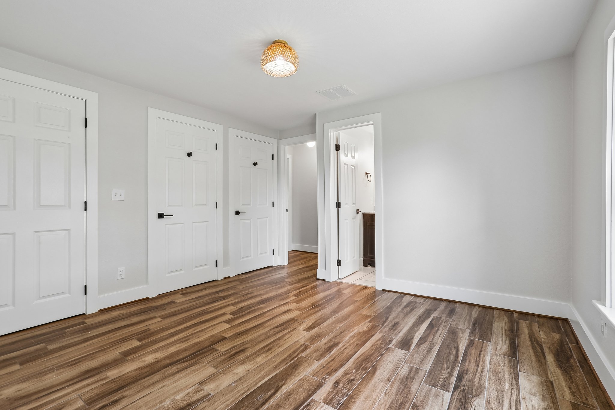 2089 Farm To Market Road 1704 Elgin, TX 78621 - Photo 20 of 31 Rich hardwood-style flooring extends through this airy room, offering comfort and enduring style.