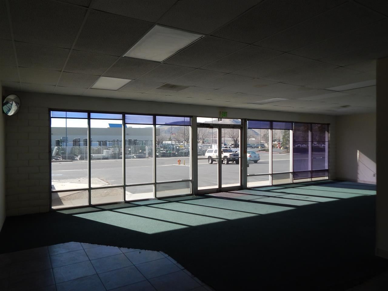 101 Hot Springs Road, Unit 7 Carson City, NV 89706 - Photo 11 of 14 a bed sitting in a room next to a large window