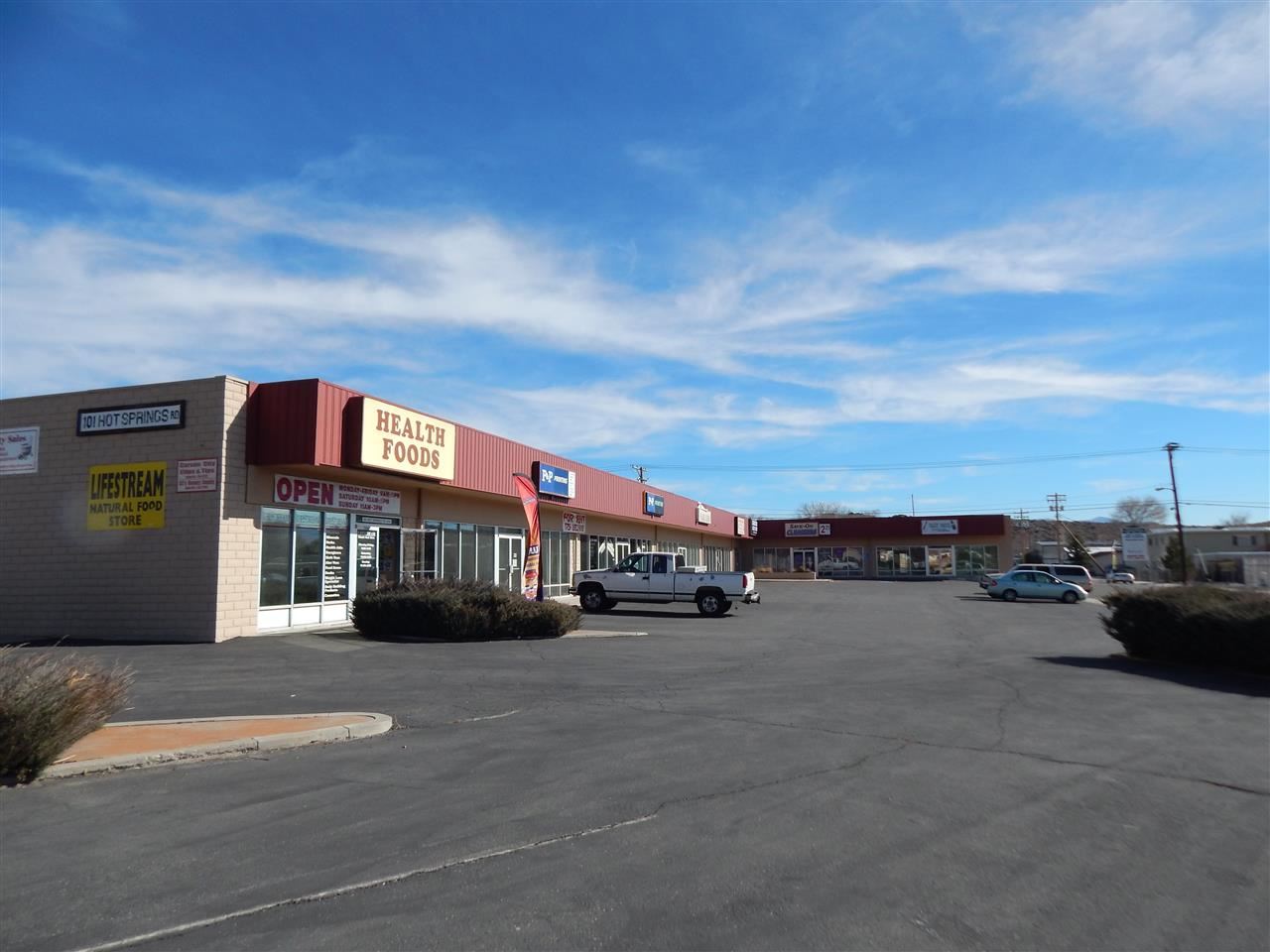 101 Hot Springs Road, Unit 7 Carson City, NV 89706 - Photo 5 of 14 a city view with tall buildings and a cars parked in front of it