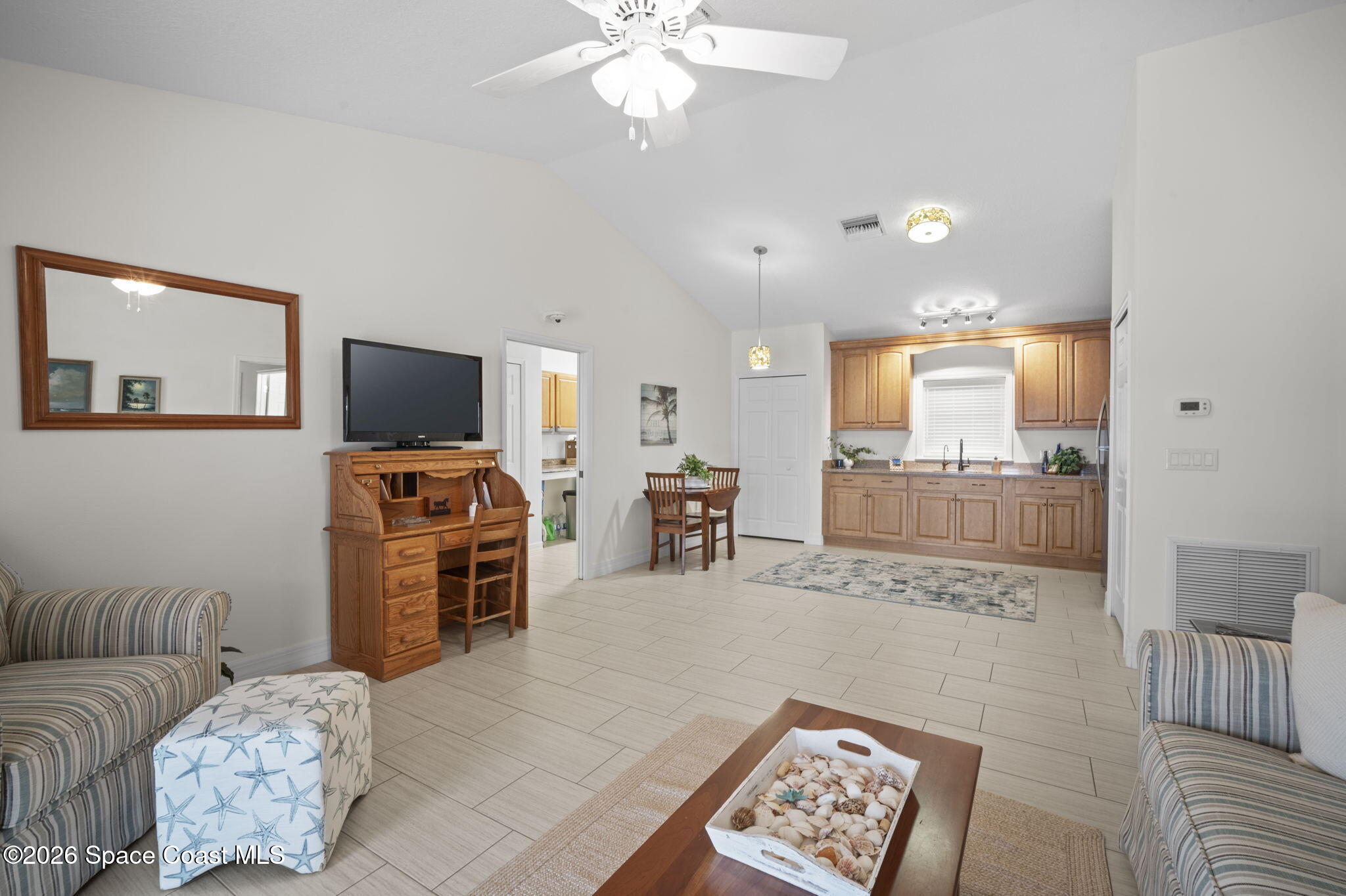 3125 Davis Road Mims, FL 32754 - Photo 31 of 47 a living room with furniture and a flat screen tv