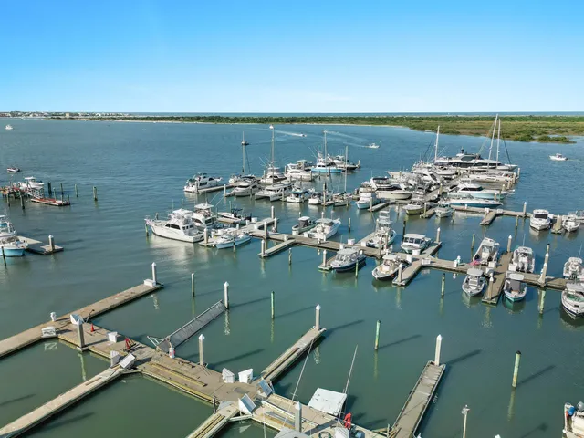 an aerial view of a city with ocean view