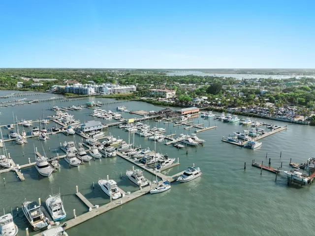an aerial view of a city with ocean
