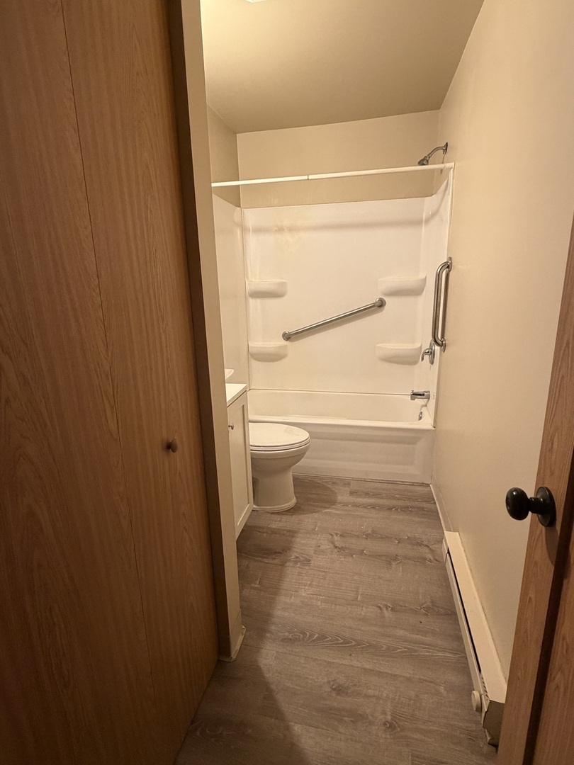 25731 West Bridge Street, Unit 2 Channahon, IL 60410 - Photo 4 of 9 a bathroom with a toilet and a shower