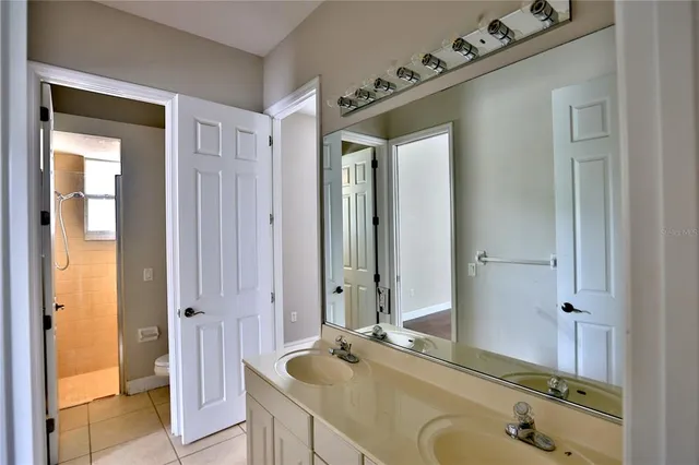 a view of a room with wooden floor and windows