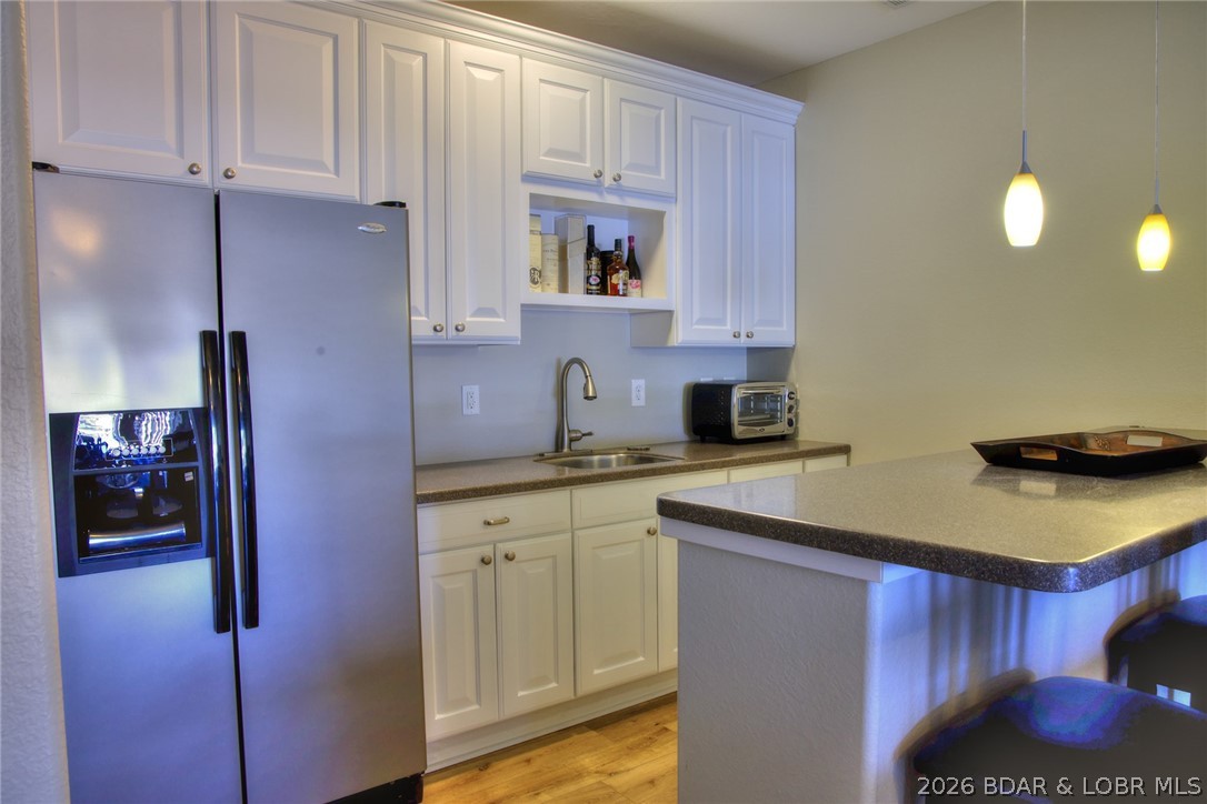 275 Flynn Road, Unit 106 Lake Ozark, MO 65049 - Photo 21 of 39 Patio level wet bar.