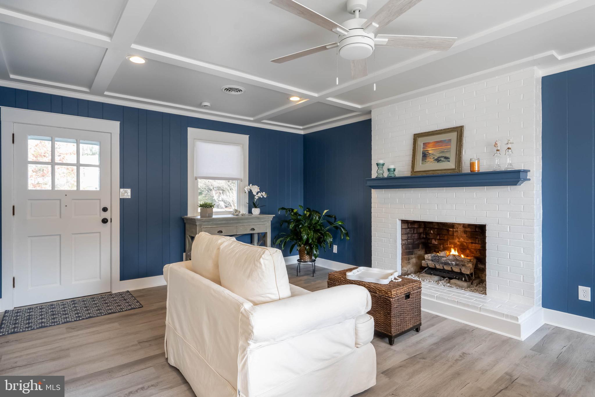 31394 Point Circle Lewes, DE 19958 - Photo 50 of 79 a living room with furniture and a fireplace