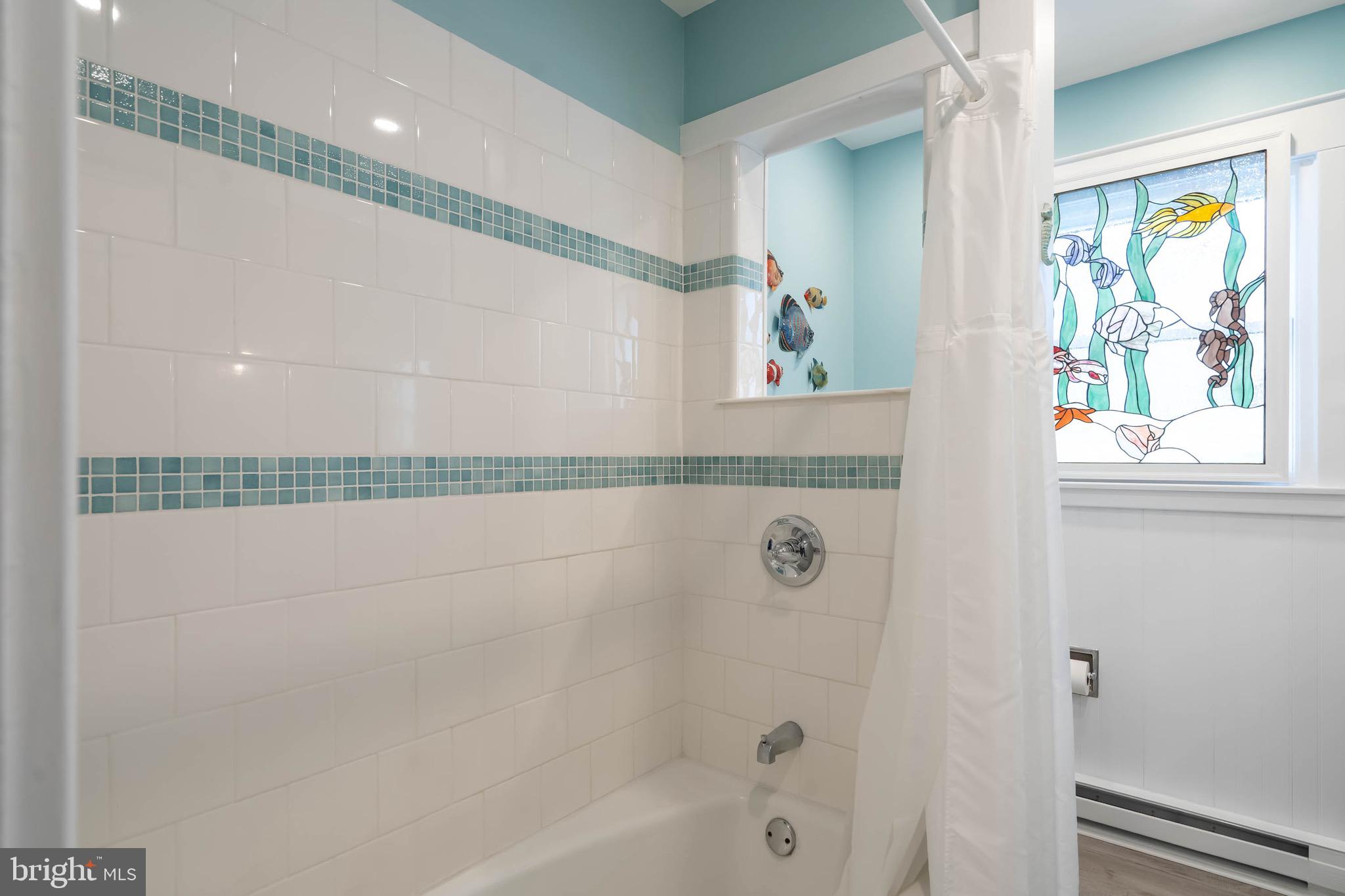 31394 Point Circle Lewes, DE 19958 - Photo 67 of 79 a bathroom with a bathtub and a shower