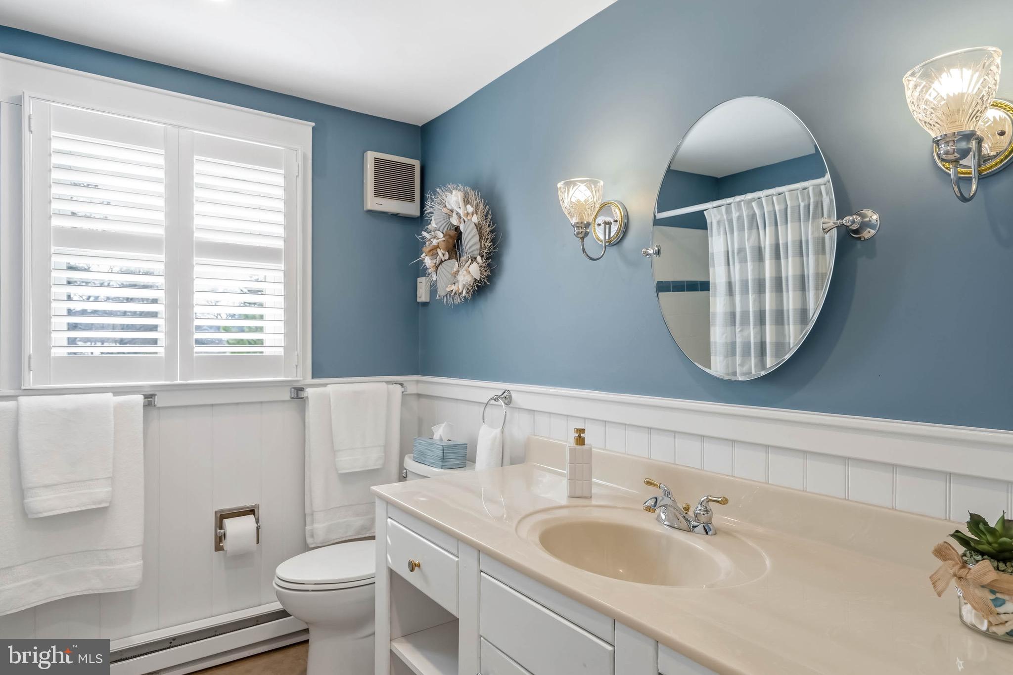 31394 Point Circle Lewes, DE 19958 - Photo 75 of 79 a bathroom with a sink mirror and toilet