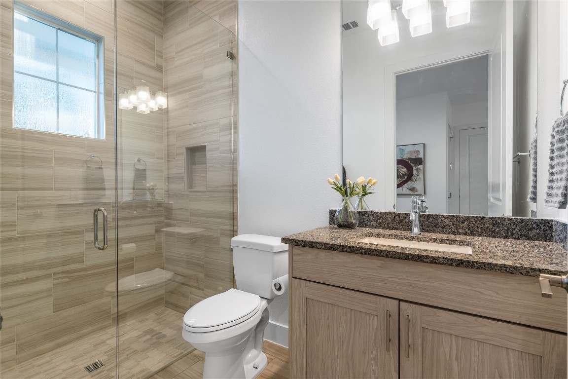 7906 Ryans Way Austin, TX 78726 - Photo 12 of 32 Downstairs full bathroom.