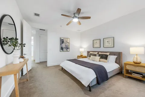 a kitchen with stainless steel appliances granite countertop a white table and chairs