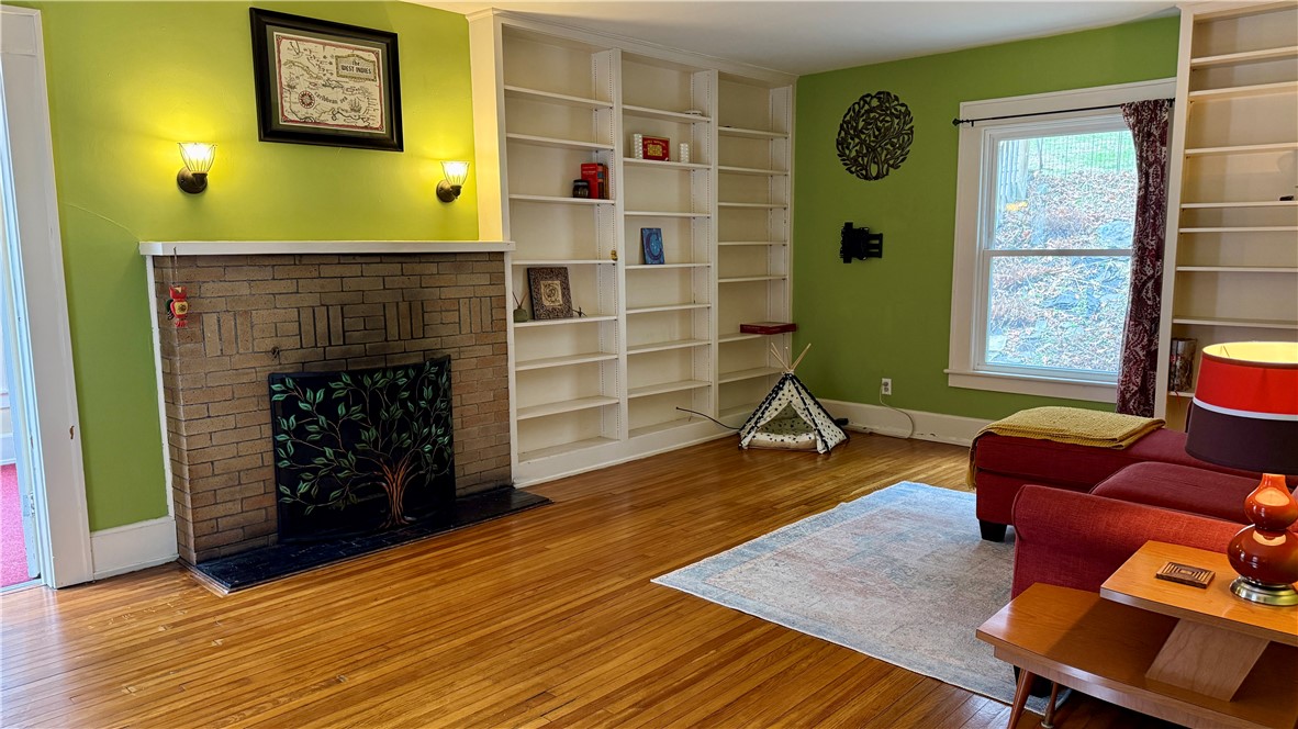 11 Cedar Street Oneonta, NY 13820 - Photo 12 of 42 Lg. Living Room with fire place built in bookcases