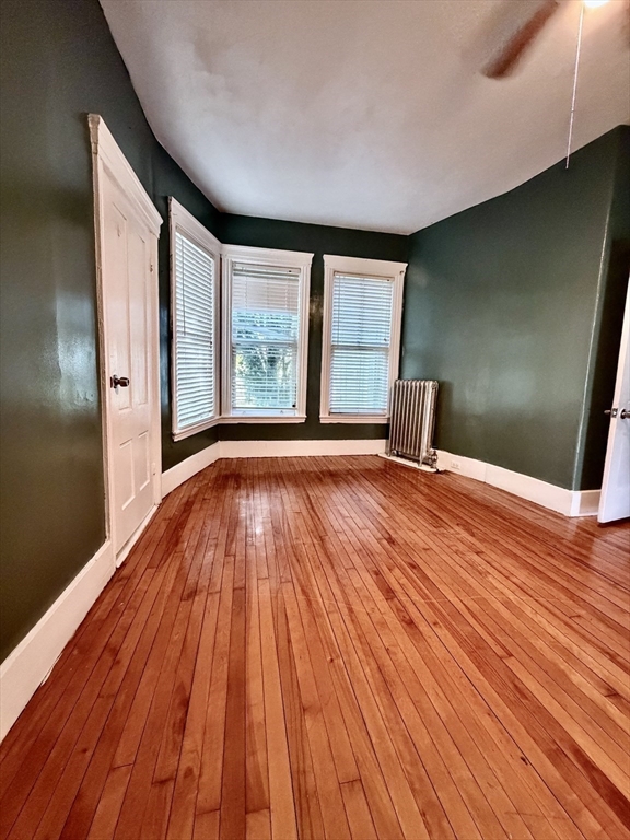 1 Congress Street, Unit 1 Worcester, MA 01609 - Photo 8 of 10 a view of an empty room with wooden floor and a window