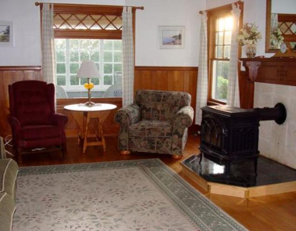 122 Point Road Hancock, ME 04640 - Photo 5 of 13 Living room with cypress wainscoting...