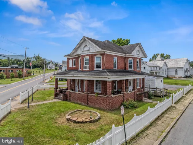 a aerial view of a house with a yard