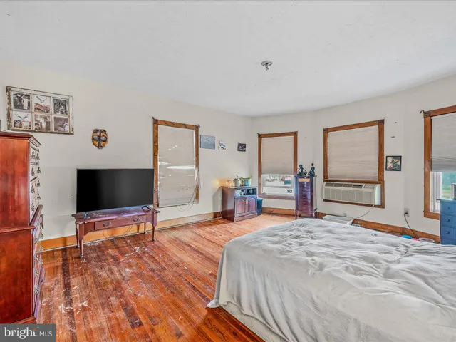 a bathroom with a sink a toilet and shower curtain