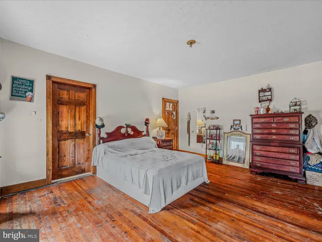 a bathroom with a sink vanity mirror and toilet