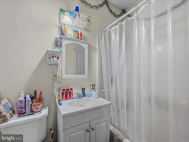 a bathroom with a sink and a window