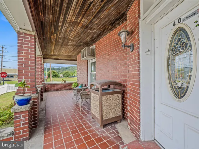 a bedroom with furniture and window