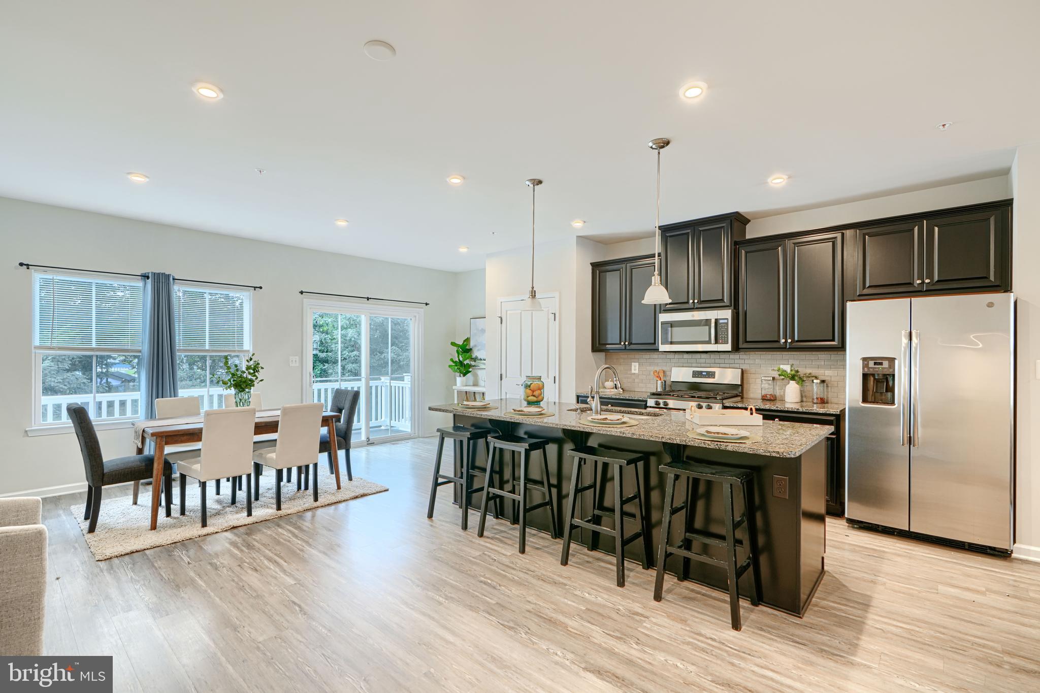 2824 Shaws Road Sparrows Point, MD 21219 - Photo 12 of 61 a large kitchen with a table and chairs