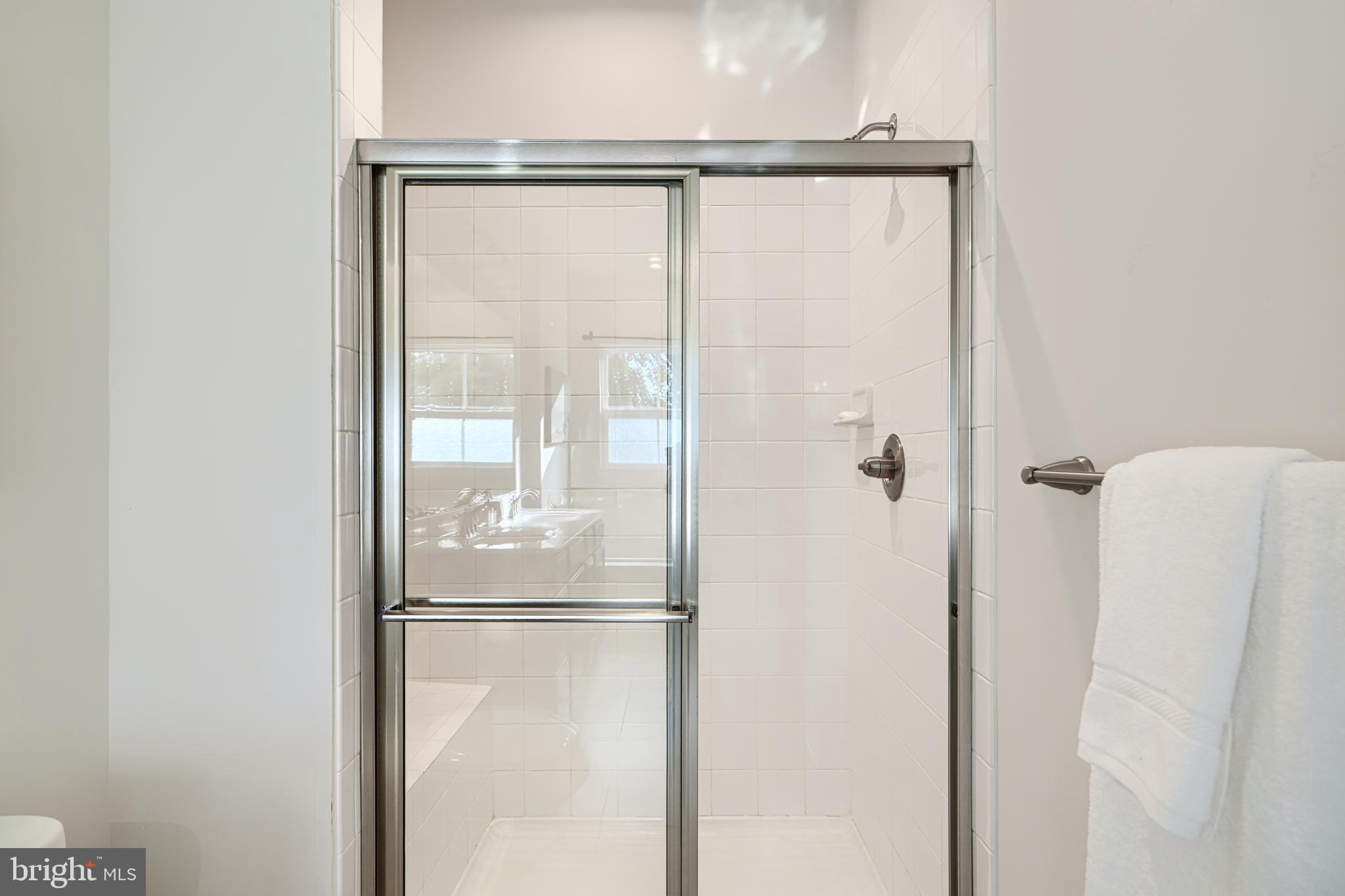 2824 Shaws Road Sparrows Point, MD 21219 - Photo 47 of 61 a bathroom with a glass shower door