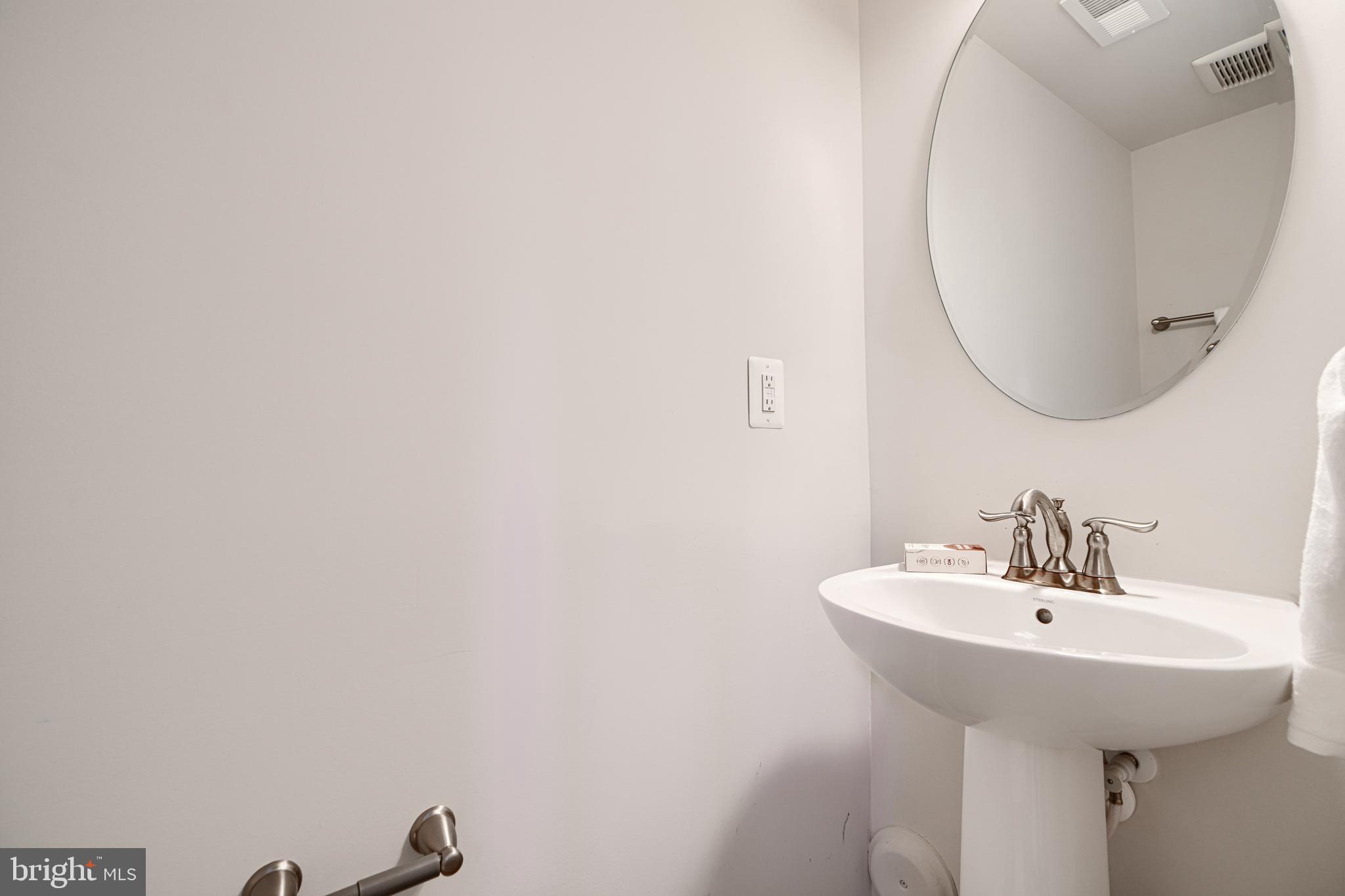2824 Shaws Road Sparrows Point, MD 21219 - Photo 57 of 61 a bathroom with a sink and a mirror