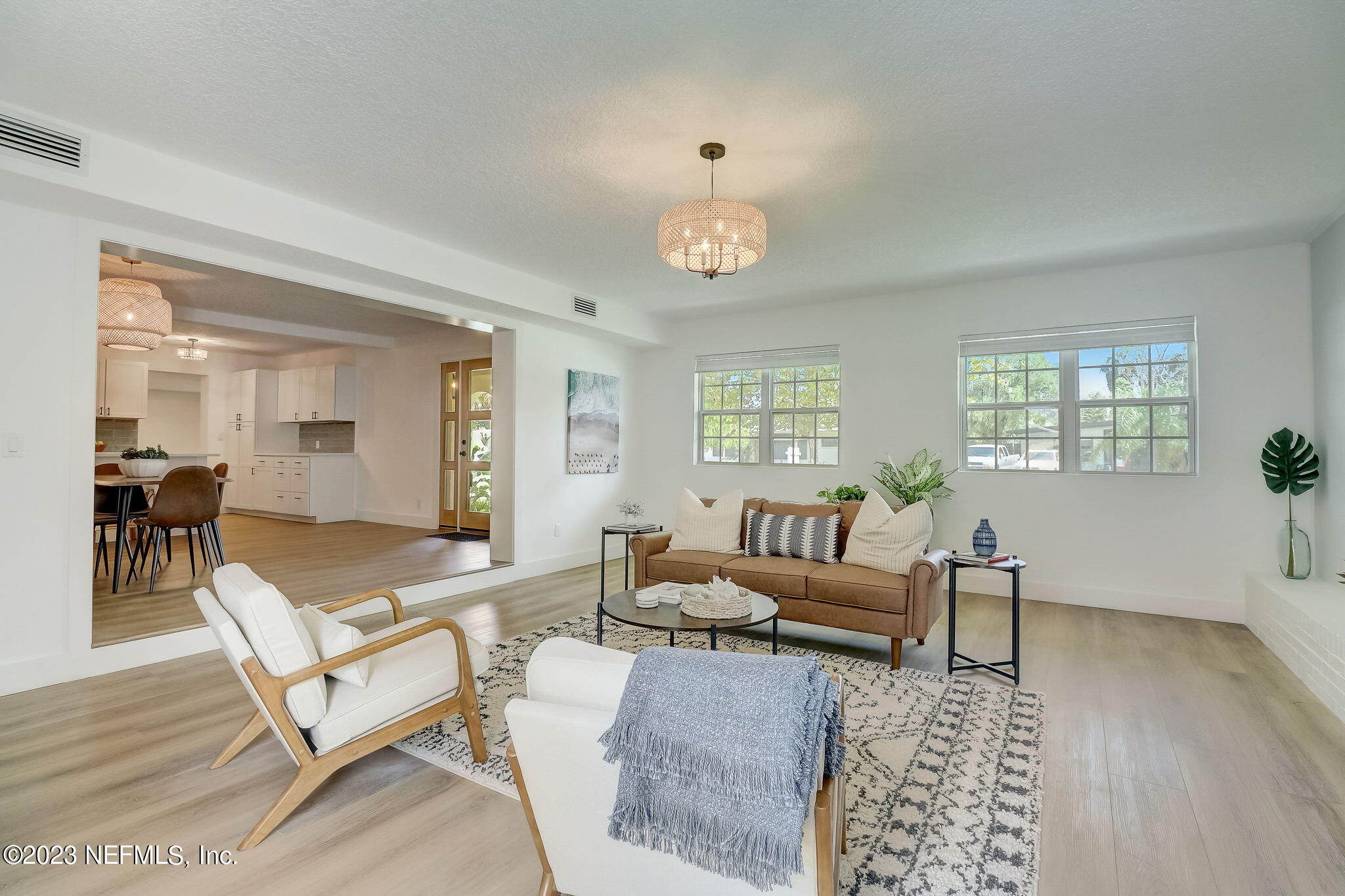 1706 Sunset Drive Jacksonville Beach, FL 32250 - Photo 13 of 44 a living room with furniture wooden floor and a table