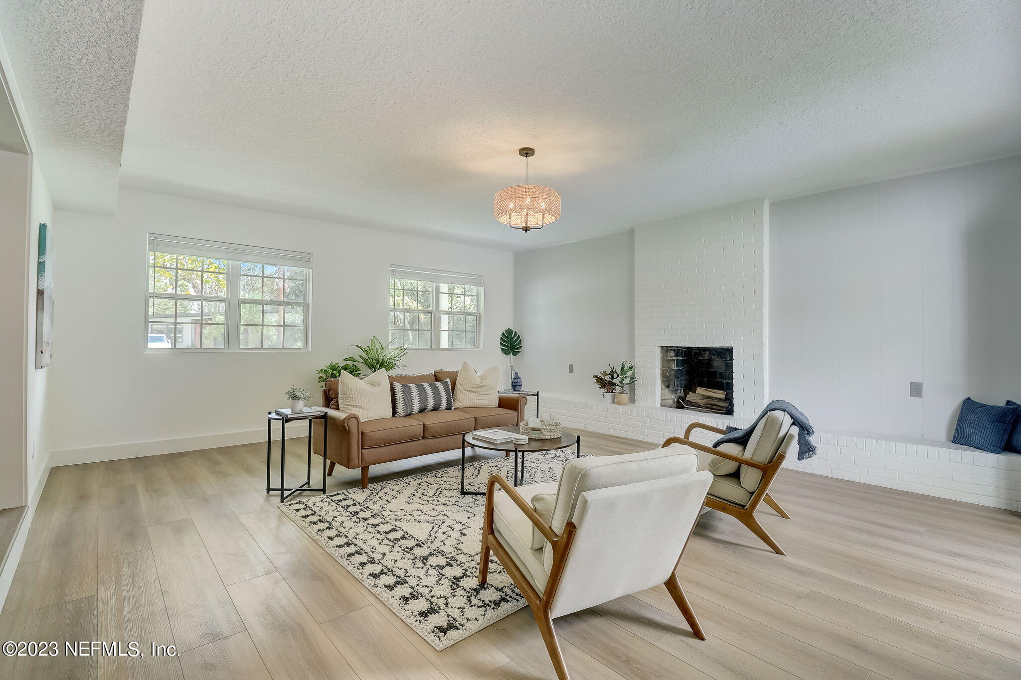 1706 Sunset Drive Jacksonville Beach, FL 32250 - Photo 14 of 44 a living room with furniture and a wooden floor
