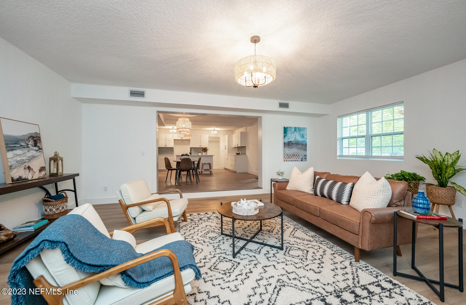 1706 Sunset Drive Jacksonville Beach, FL 32250 - Photo 15 of 44 a living room with furniture ceiling fan and a window