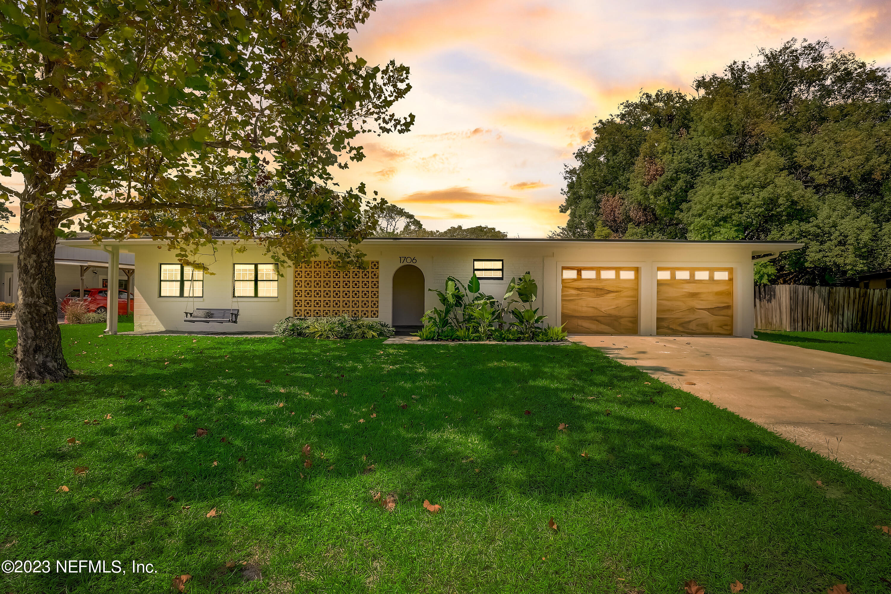 1706 Sunset Drive Jacksonville Beach, FL 32250 - Photo 2 of 44 a view of a house with a backyard