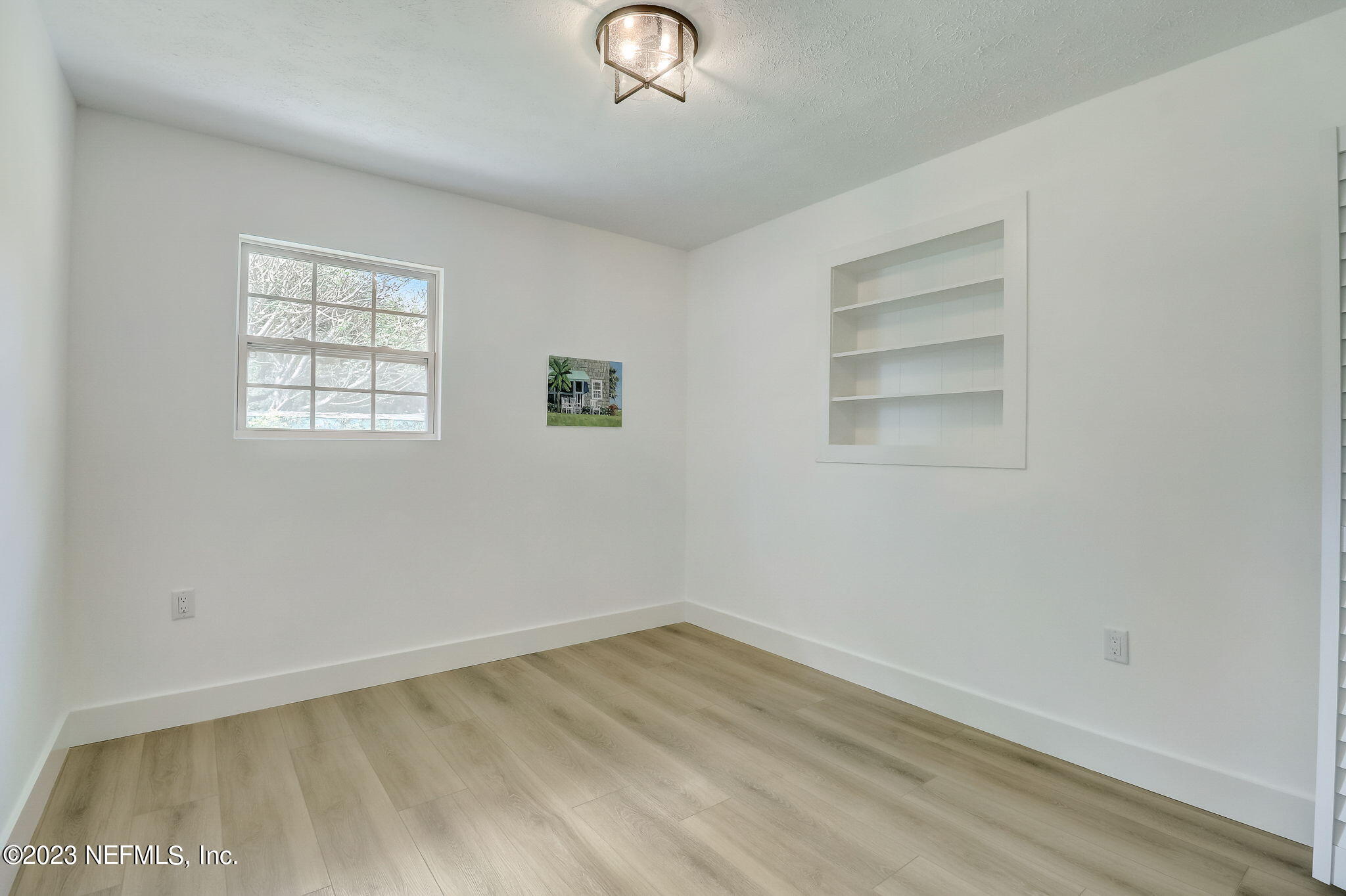 1706 Sunset Drive Jacksonville Beach, FL 32250 - Photo 21 of 44 an empty room with a window