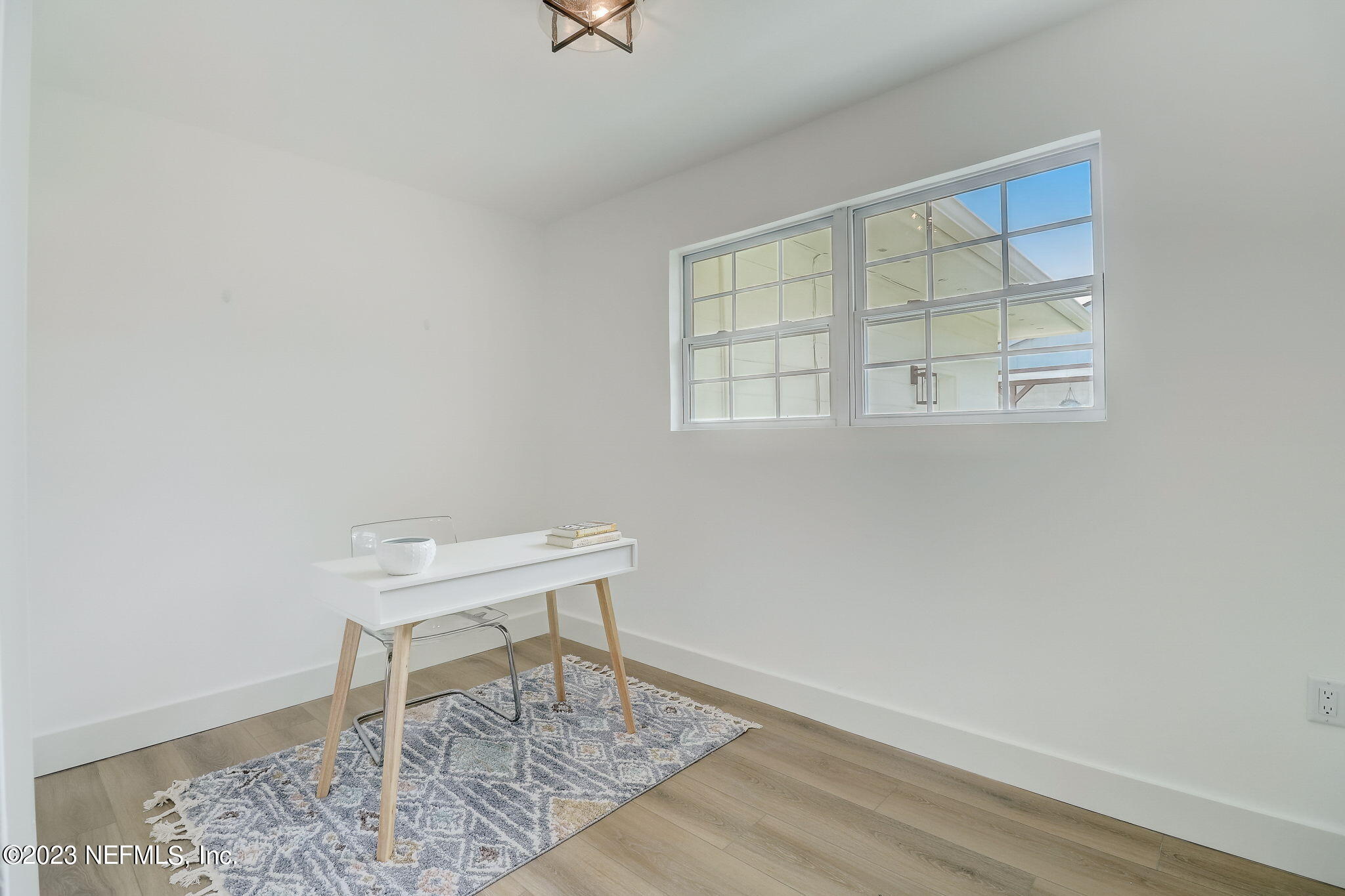 1706 Sunset Drive Jacksonville Beach, FL 32250 - Photo 24 of 44 an empty room with a window