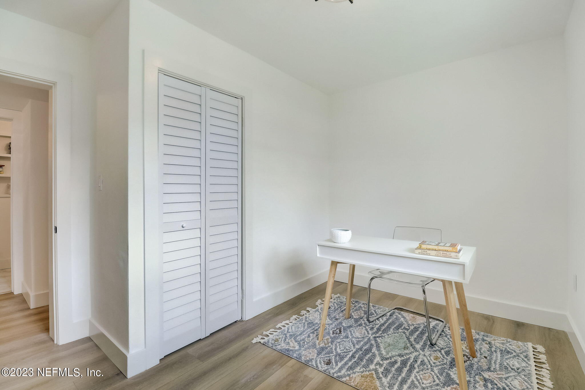 1706 Sunset Drive Jacksonville Beach, FL 32250 - Photo 25 of 44 a workspace with furniture and a window