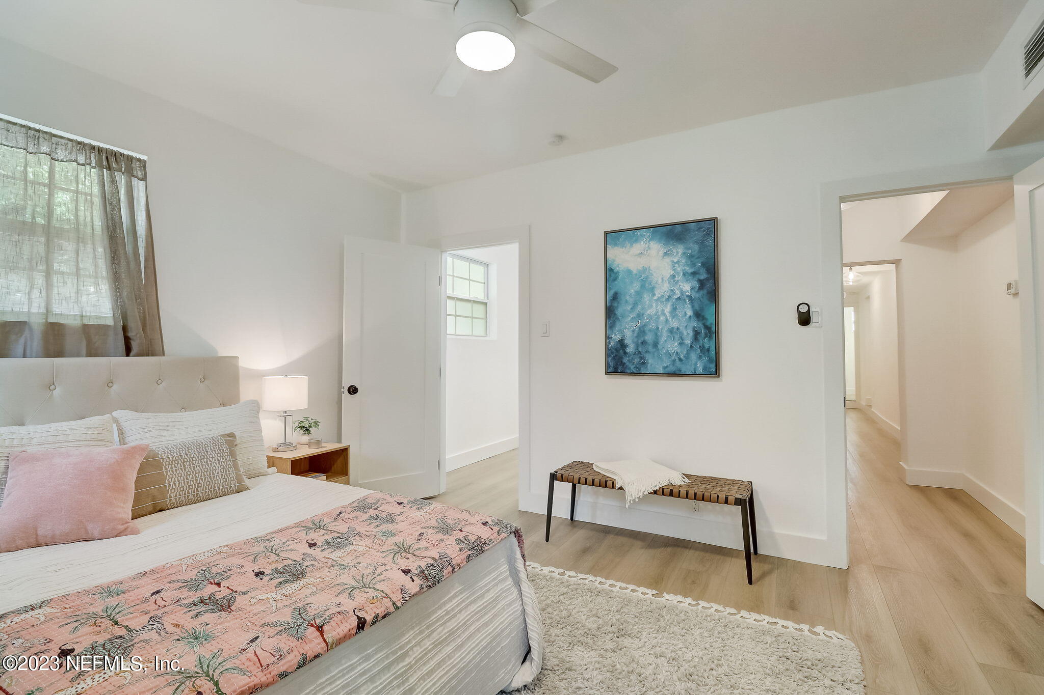 1706 Sunset Drive Jacksonville Beach, FL 32250 - Photo 27 of 44 a bedroom with a bed and a chair