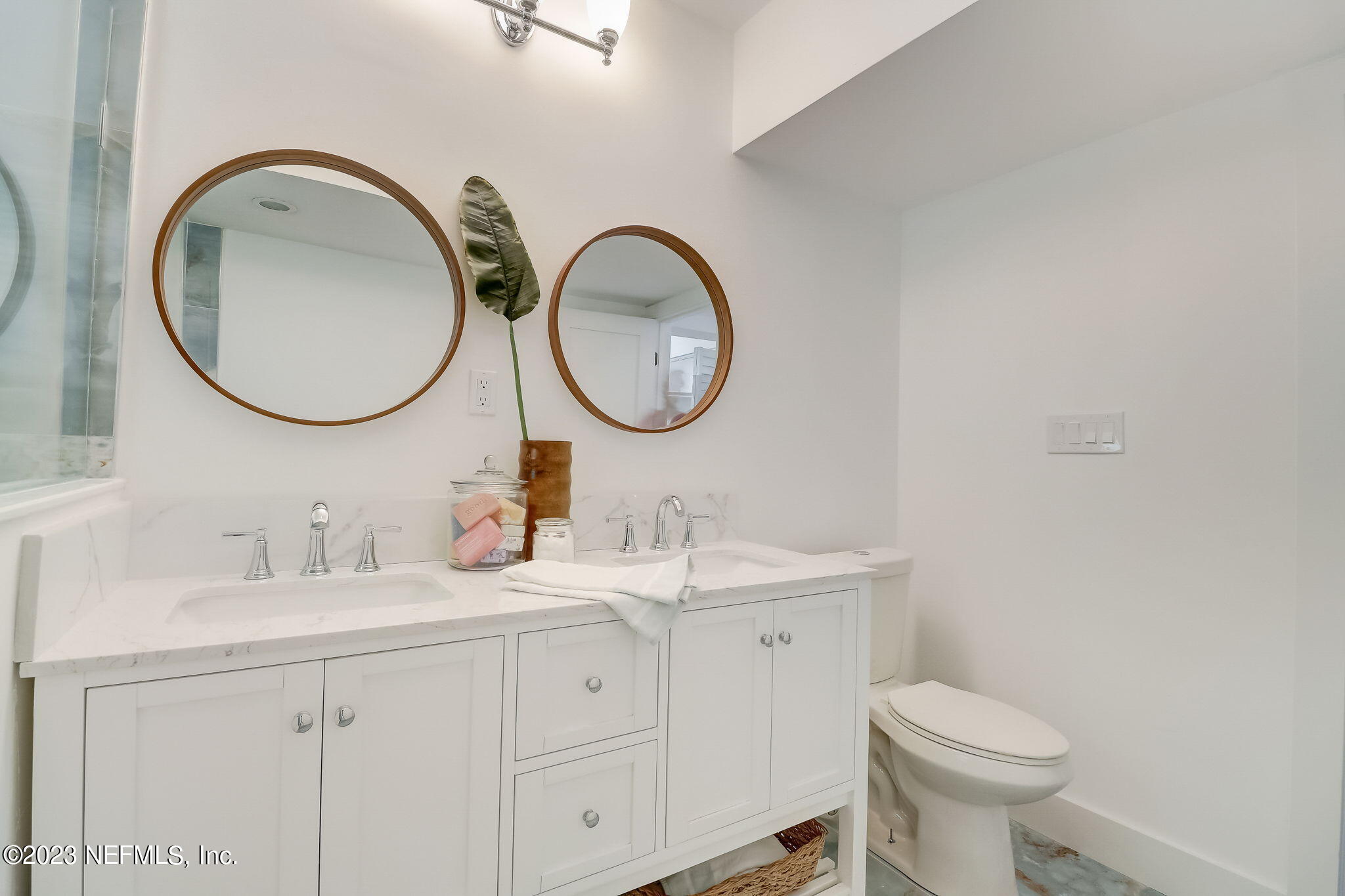 1706 Sunset Drive Jacksonville Beach, FL 32250 - Photo 29 of 44 a bathroom with a toilet a sink and a mirror
