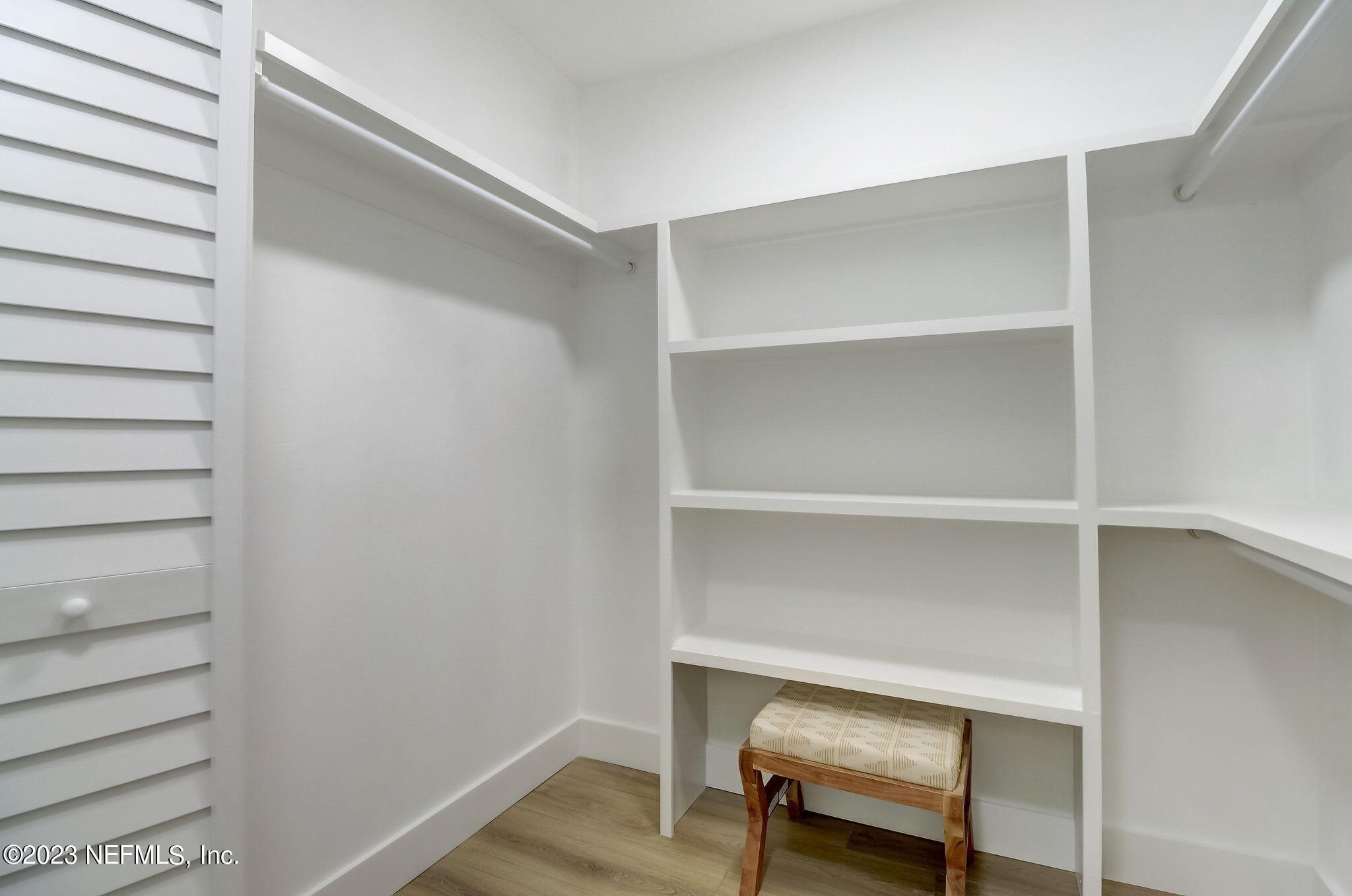 1706 Sunset Drive Jacksonville Beach, FL 32250 - Photo 31 of 44 a view of walk in closet with empty racks