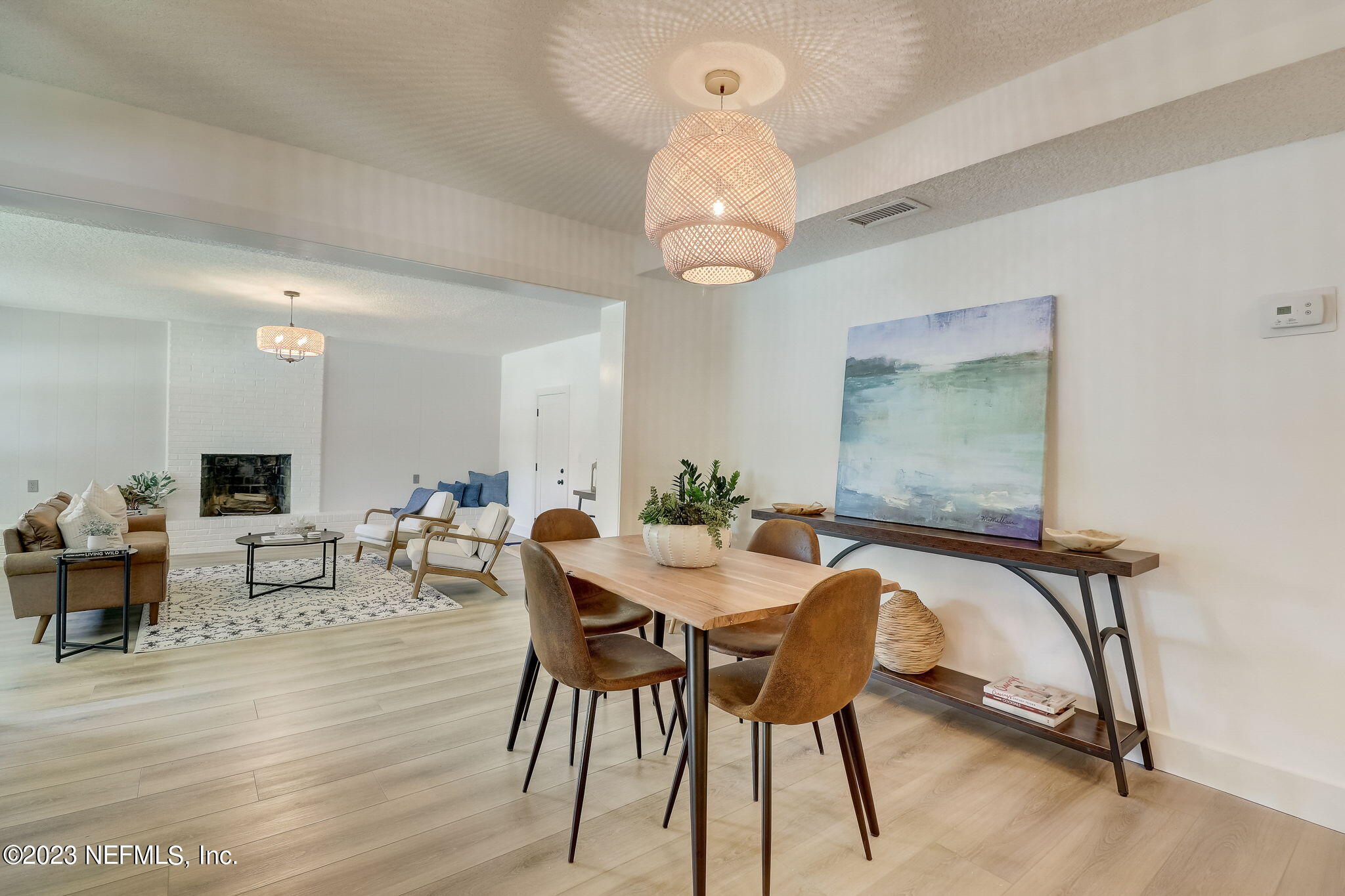 1706 Sunset Drive Jacksonville Beach, FL 32250 - Photo 7 of 44 a view of a dining room with furniture and wooden floor