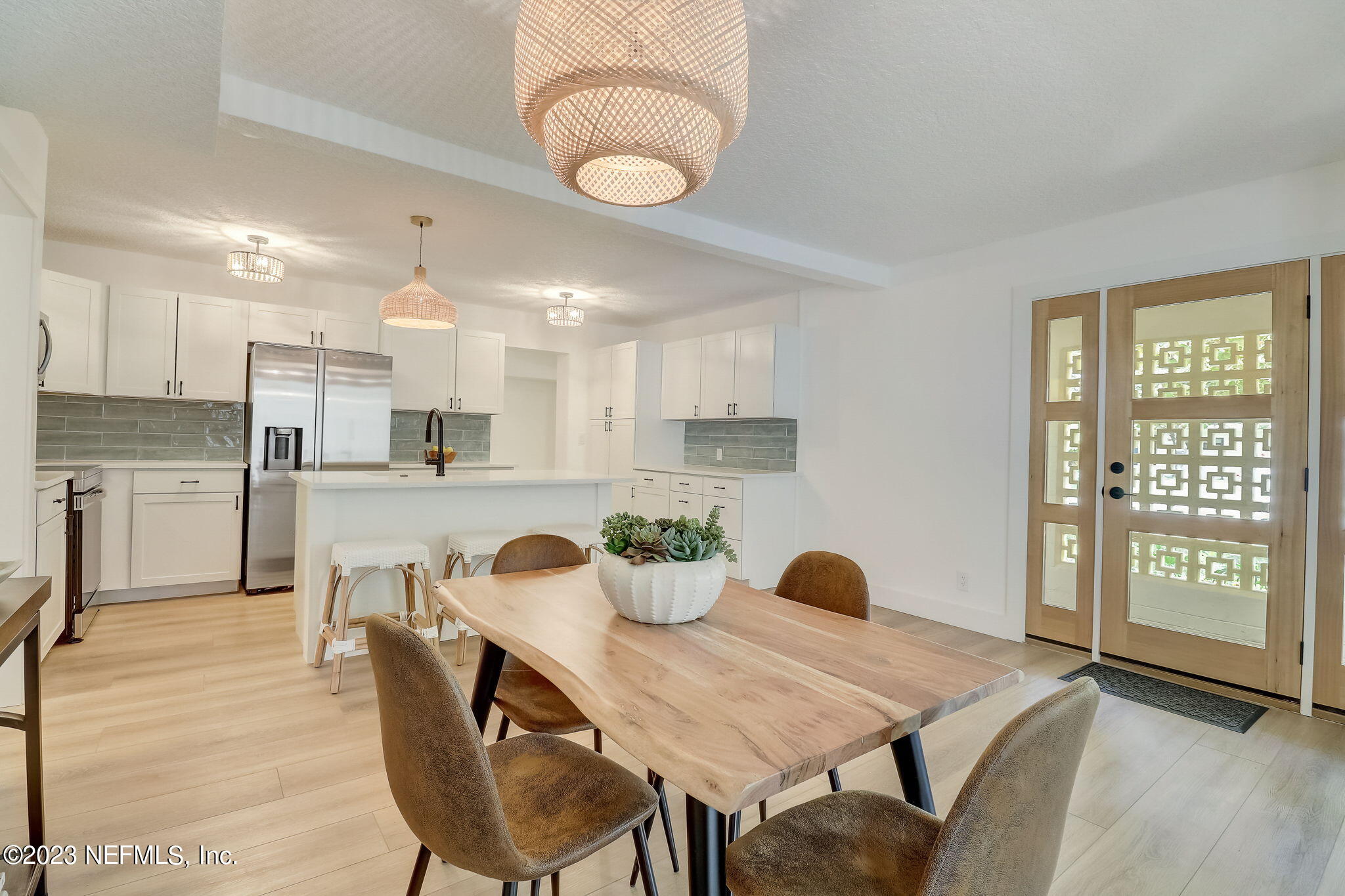 1706 Sunset Drive Jacksonville Beach, FL 32250 - Photo 8 of 44 a kitchen with dining table and chairs