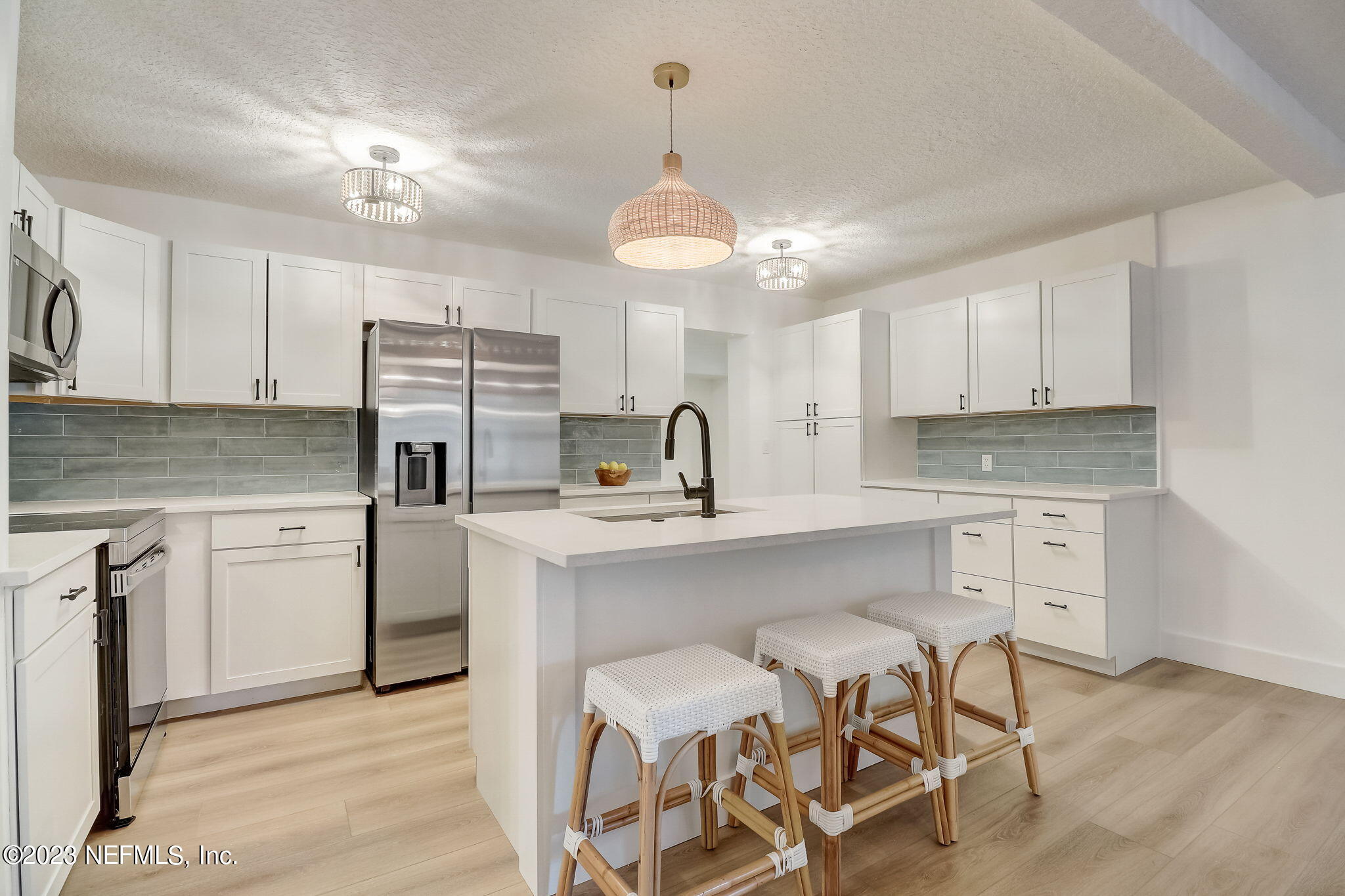 1706 Sunset Drive Jacksonville Beach, FL 32250 - Photo 9 of 44 a kitchen with a sink cabinets and window