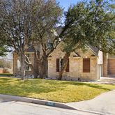 a swimming pool with trees in front of it
