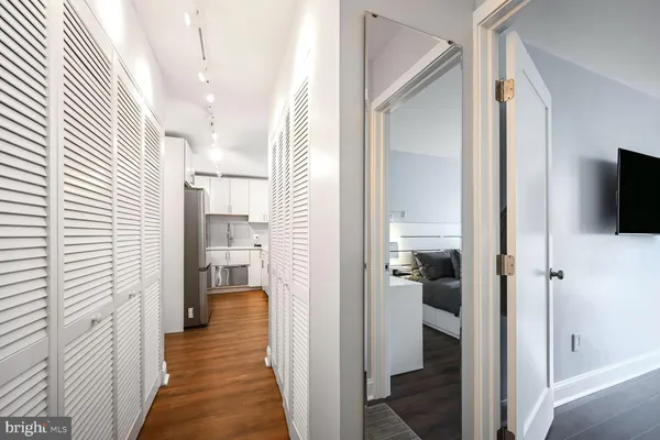 a kitchen with stainless steel appliances a refrigerator sink and microwave