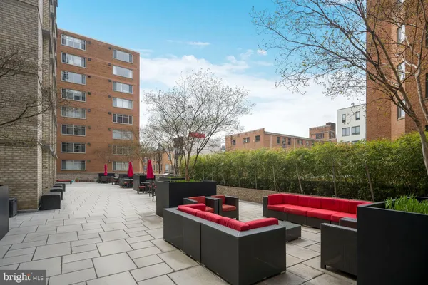 a view of a balcony with wooden floor